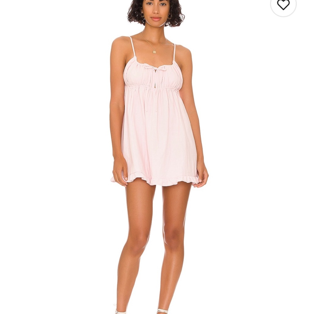 Pink mini dress from REVOLVE. the brand is More to Come.